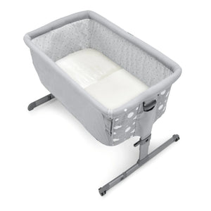 Crib with a satin bed sheet fit inside